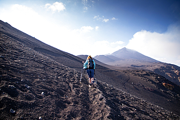 hiker trekking on mount Etna