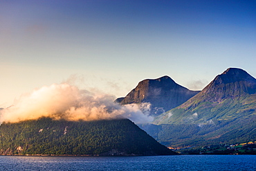 Low cloud catches the setting sun on Nordfjord (Northern Fjord), Norway, Scandinavia, Europe