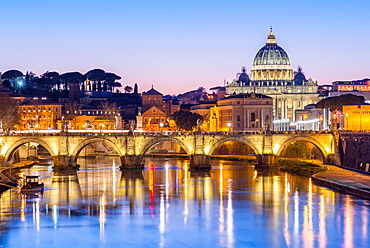 St. Peters Basilica and the Vatican with Ponte St Angelo over the River Tiber at dusk, Rome, Lazio, Italy, Europe