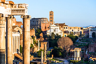 Ancient Roman cityscape at Roman Forum with Basilica of Maxentius and the Coloseum, UNESCO World Heritage Site, Rome, Lazio, Italy, Europe