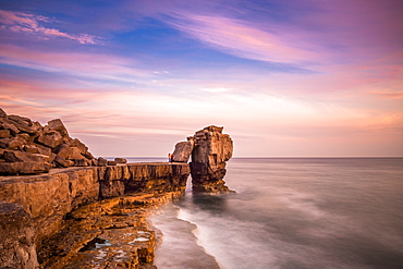 Sunset at Pulpit Rock, limestone sea stack on heavily quarried coast of Portland Bill on England's Jurassic Coast, UNESCO World Heritage Site, Dorset, England, United Kingdom, Europe