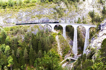 Steam train crosses the Landwasser Viadukt, UNESCO World Heritage Site, Filisur, Albula Valley, Graubunden, Switzerland, Europe