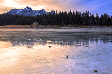 Colors of the sunset reflected on the icy surface of Lake Palu, Malenco Valley, Valtellina, Lombardy, Italy, Europe