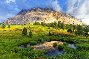 Sasso di Santa Croce reflected in a pond, La Valle (La Val) (Wengen), Badia Valley, South Tyrol, Dolomites, Italy, Europe