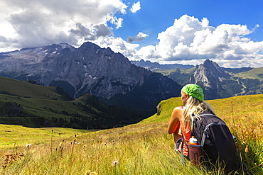 Girl looks towards Marmolada from Viel del Pan path, Pordoi Pass, Fassa Valley, Trentino, Dolomites, Italy, Europe