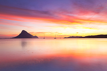 Amazing sunrise on the beach of Porto Taverna with the Tavolara Island in the background, Loiri Porto San Paolo, Olbia Tempio province, Sardinia, Italy, Mediterranean, Europe