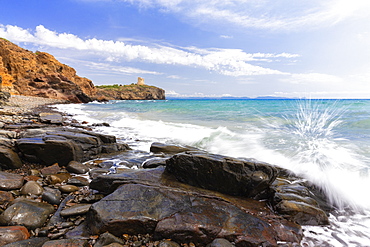 Wave breaks on the rocks. Cannai Tower(Torre Cannai), Sant'Antioco Island, Sud Sardegna province, Sardinia, Italy, Mediterranean, Europe