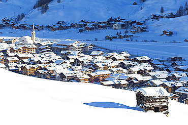 Village illuminated by sun after a snowfall, Livigno, Valtellina, Lombardy, Italy, Europe