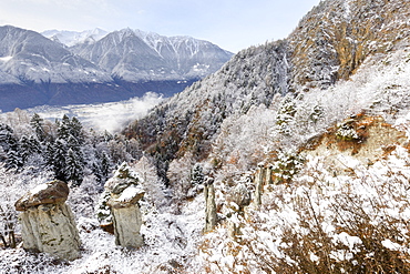 Hoodoos of Postalesio after a snowfall, Postalesio, Valtellina, Lombardy, Italy, Europe