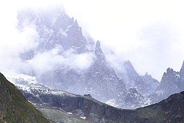 Summer blizzard on Monzino Hut and Aiguille Noire de Peuterey, Monzino Hut, Veny Valley, Courmayeur, Aosta Valley, Italy, Europe