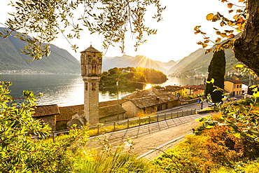 Traditional bell tower of Ossuccio with view of the Comacina Island and Lake Como, Lombardy, Italian Lakes, Italy, Europe