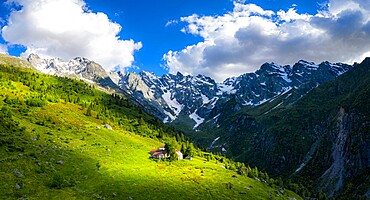 Ancient group of huts illuminated by sun, Val d'Arigna, Valtellina, Orobie Alps, Lombardy, Italy, Europe