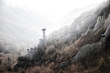 Earth pyramids of Zone in the fog, Zone, Brescia province, Lombardy, Italy, Europe