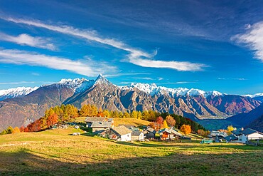 Amazing clouds above a traditional mountain village, Valchiavenna, Lombardy, Italy, Europe