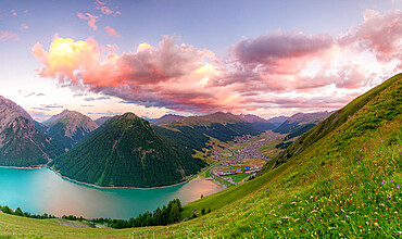 Livigno and lake at sunset, Livigno Valley, Valtellina, Lombardy, Italy, Europe