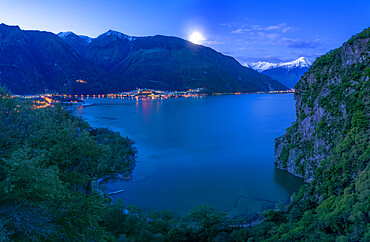 San Fedelino Bay from above illuminated by moon at twilight, Lago di Novate, Valchiavenna, Valtellina, Lombardy, Italy, Europe