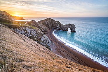 Durdle Door at sunrise, Lulworth Cove, Jurassic Coast, UNESCO World Heritage Site, Dorset, England, United Kingdom, Europe