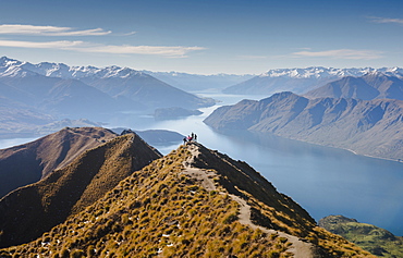 Hikers enjoying the view from the Roys Peak hiking trail near Wanaka, Otago, South Island, New Zealand, Pacific