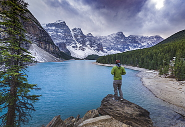 Tourist watching the scenery of the Moraine Lake, Banff National Park, UNESCO World Heritage Site, Canadian Rockies, Alberta, Canada, North America