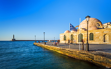 Hassan Pasha Mosque and The Venetian era harbour and the lighthouse at the port of Chania, Crete, Greek Islands, Greece, Europe