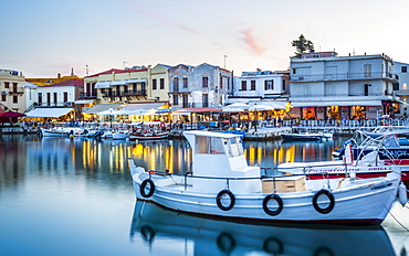 Old Venetian harbour, taverns on seaside at dusk, Rethymno (Rethymnon), Crete, Greek Islands, Greece, Europe