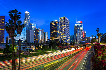 Downtown financial district of Los Angeles city and busy freeway at night, Los Angeles, California, United States of America, North America