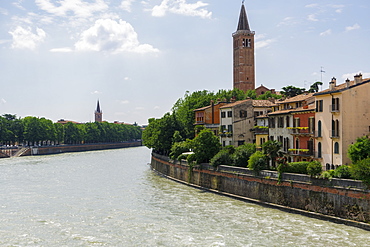 River view with river bank building, hilltop church and sanctuary of Madonna di Lourdes, Verona, Veneto, Italy, Europe