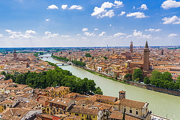 Adige River view with bridges, traditional buildings and church bell towers on river banks, Verona, Veneto, Italy, Europe