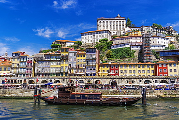 Traditional waterfront houses in the Ribeira district and boat on the Douro River, Porto, Portugal, Europe