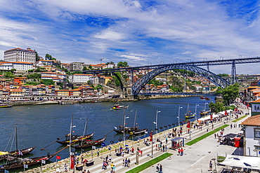 View of Dom Luis I Bridge over Douro River and Vila Nova de Gaia waterfront with Porto wine ships and Ribeira view, Porto, Portugal, Europe