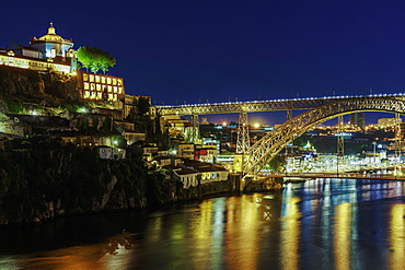 View of Monastery of Saint Augustine of Serra do Pilar and Dom Luis Bridge over the Douro River at night, Porto, Portugal, Europe