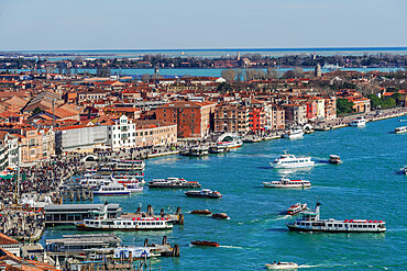 Panoramic day view of waterfront with boats and low rise buildings with red tiles, seen from St. Marks Campanile, Venice, UNESCO World Heritage Site, Veneto, Italy, Europe