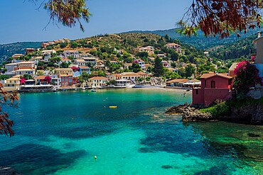 Sunny view of traditional Asos Village with low-rise houses by the sea in Kefalonia village, Kefalonia, Ionian Islands, Greek Islands, Greece, Europe