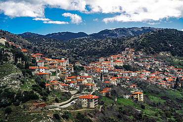 Greek village mountain view panorama with traditional low-rise houses with red roof tiles in Dimitsana, Arcadia, Peloponnese, Greece, Europe