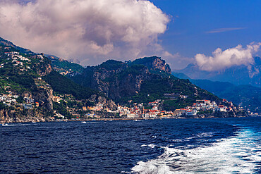 Sea view of low rise traditional buildings along Costiera Amalfitana coastline, viewed from a ship, Amalfi Coast, UNESCO World Heritage Site, Campania, Italy, Europe