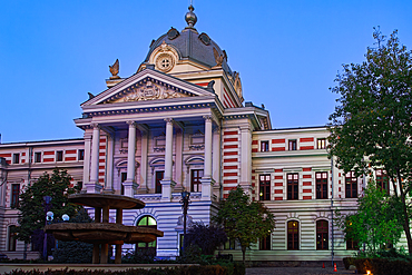 Evening facade view of Coltea Clinical Hospital (Spitalul Clinic Coltea) 1888 historical building, under a clear sky, Bucharest, Romania, Europe