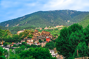 Hill houses surrounded by green vegetation in the Pyrenees mountains in the capital, Andorra la Vella, Andorra, Europe