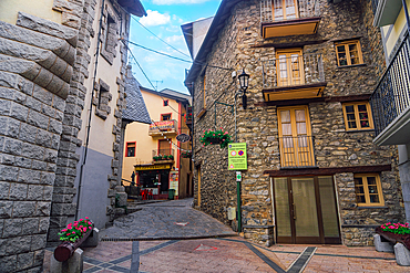 Traditional low-rise houses along a cobblestone alley in the capital, Andorra la Vella, Andorra, Pyrenees mountains, Europe