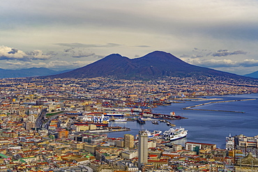 Panoramic city view over Seaport of Napoli with ships and Mount Vesuvius volcano, seen from Sant Elmo castle, Naples, Campania, Italy, Europe