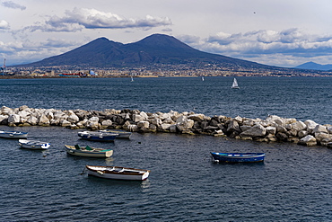 Day view of Mount Vesuvius, the active volcano, seen from the Gulf of Napoli with buildings ashore, Naples, Campania, Italy, Europe