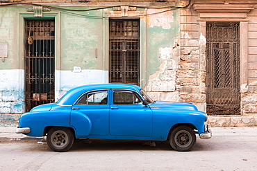 Old blue American car parked on street in Havana, Cuba, West Indies, Caribbean, Central America