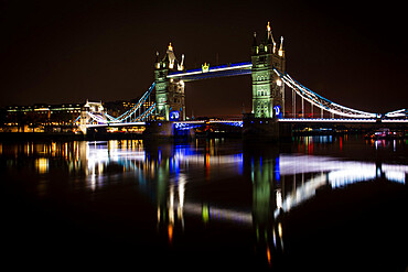 Tower Bridge and reflections in the River Thames at night, London, England, United Kingdom, Europe