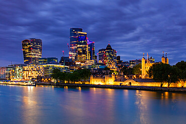 City of London skyscrapers including Walkie Talkie building and Tower of London at dusk, London, England, United Kingdom, Europe