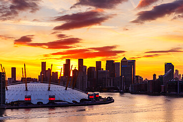 Sunset behind Canary Wharf, Docklands, and O2 Arena, London, England, United Kingdom, Europe