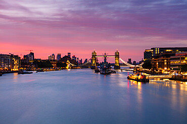 Tower Bridge, HMS Belfast, River Thames and Canary Wharf skyline at sunrise, London, England, United Kingdom, Europe