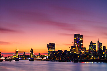 The City of London skyline at sunset including Tower Bridge, the Gherkin and The Walkie Talkie Building, London, England, United Kingdom, Europe