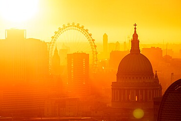 Aerial view of London skyline at sunset, including London Eye and St. Paul's Cathedral, London, England, United Kingdom, Europe