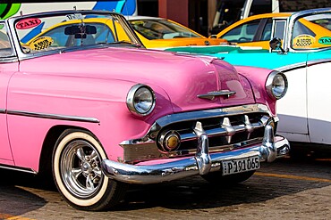 Close up detail of pink vintage American car taxi, Havana, Cuba, West Indies, Central America