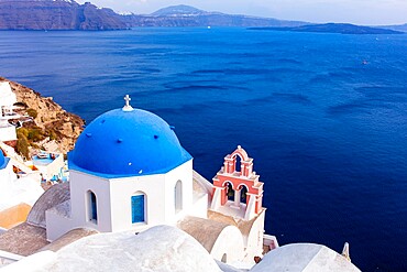 A white church with blue dome overlooking the Aegean Sea, Santorini, Cyclades, Greek Islands, Greece, Europe