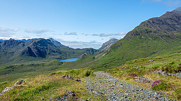 The rough road from Kilmarie to Camasunary with the towering pinnacles of Sgurr nan Gillean in the distance, Isle of Skye, Inner Hebrides, Scotland, United Kingdom, Europe